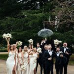 Modern uneven wedding party celebrating together outdoors during a luxury Niagara wedding with candid moments, natural posing, and authentic guest interaction.