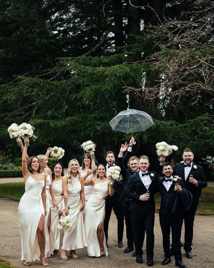 Modern uneven wedding party celebrating together outdoors during a luxury Niagara wedding with candid moments, natural posing, and authentic guest interaction.