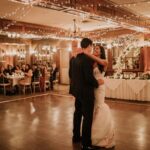 Bride and groom sharing their first dance during a romantic candlelit wedding reception at Pillar and Post in Niagara-on-the-Lake