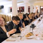 Wedding guests enjoying dinner and conversation during an elegant reception at Peller Estates Winery in Niagara-on-the-Lake