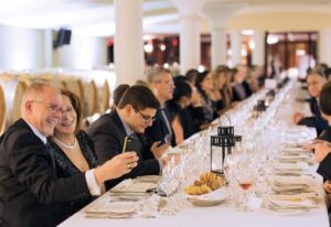 Wedding guests enjoying dinner and conversation during an elegant reception at Peller Estates Winery in Niagara-on-the-Lake