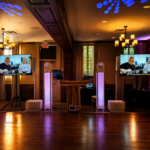 Luxury wedding DJ setup at Pillar and Post Hotel featuring professional lighting, TV displays, and upscale reception production
