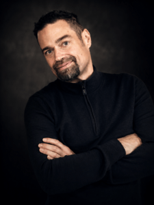 Professional portrait of DJ Luka Miller from Icon Events featuring a cinematic luxury-style headshot with dark background and modern branding aesthetic.