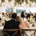 Bride and groom sharing an intimate moment during an elegant wedding reception with immersive atmosphere and candlelit décor