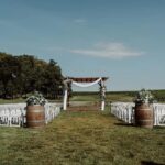 Elegant outdoor wedding ceremony at Kurtz Orchards in Niagara-on-the-Lake with romantic live music atmosphere and vineyard-inspired setting