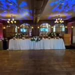 Pillar and Post wedding reception with lighting and elegant head table in Niagara-on-the-Lake.
