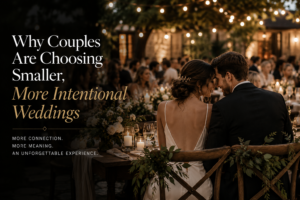 Bride and groom sharing an intimate moment at a candlelit Niagara-on-the-Lake wedding reception with guests gathered around them.