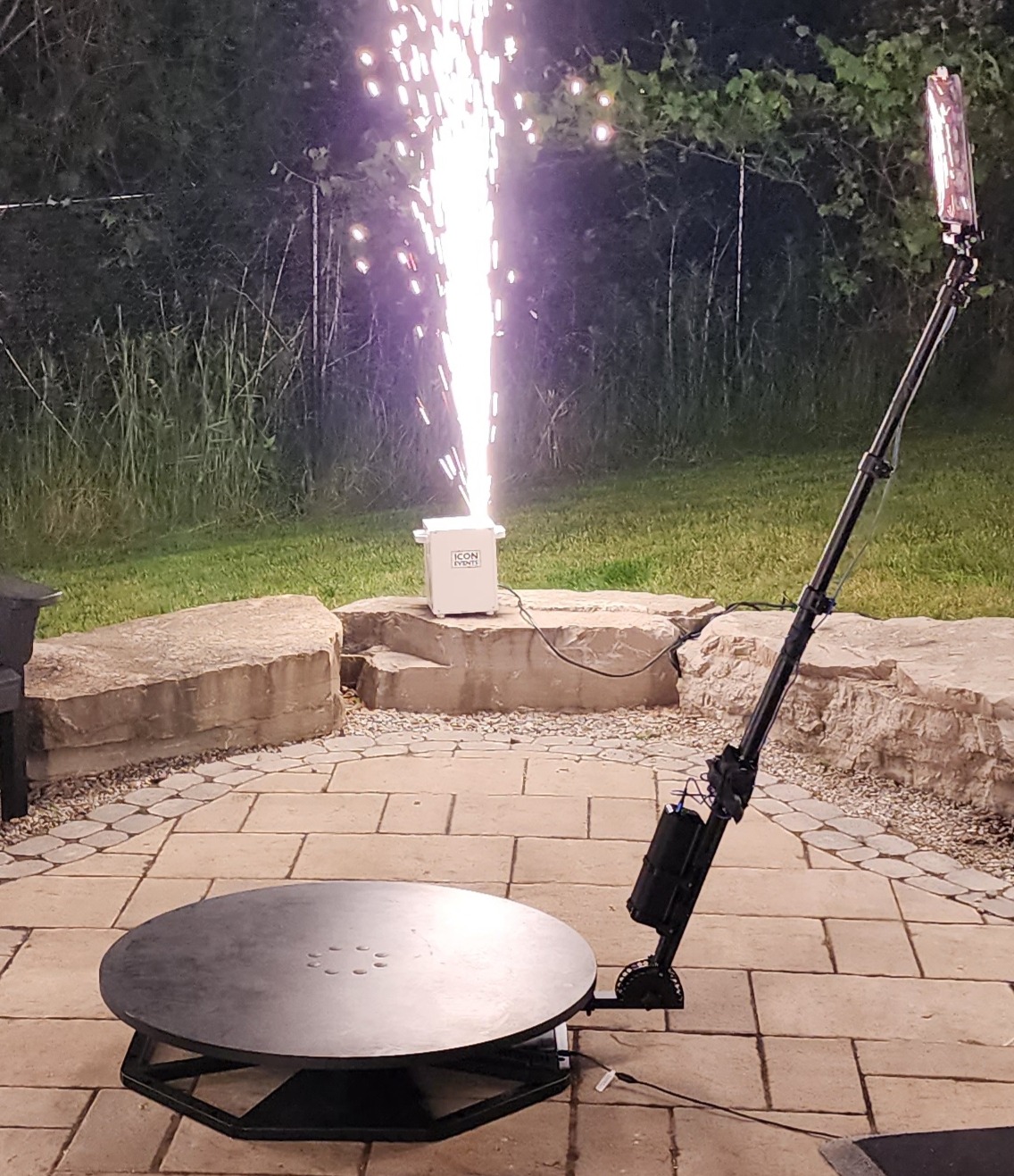 Close view of 360 booth platform and camera arm at an outdoor event