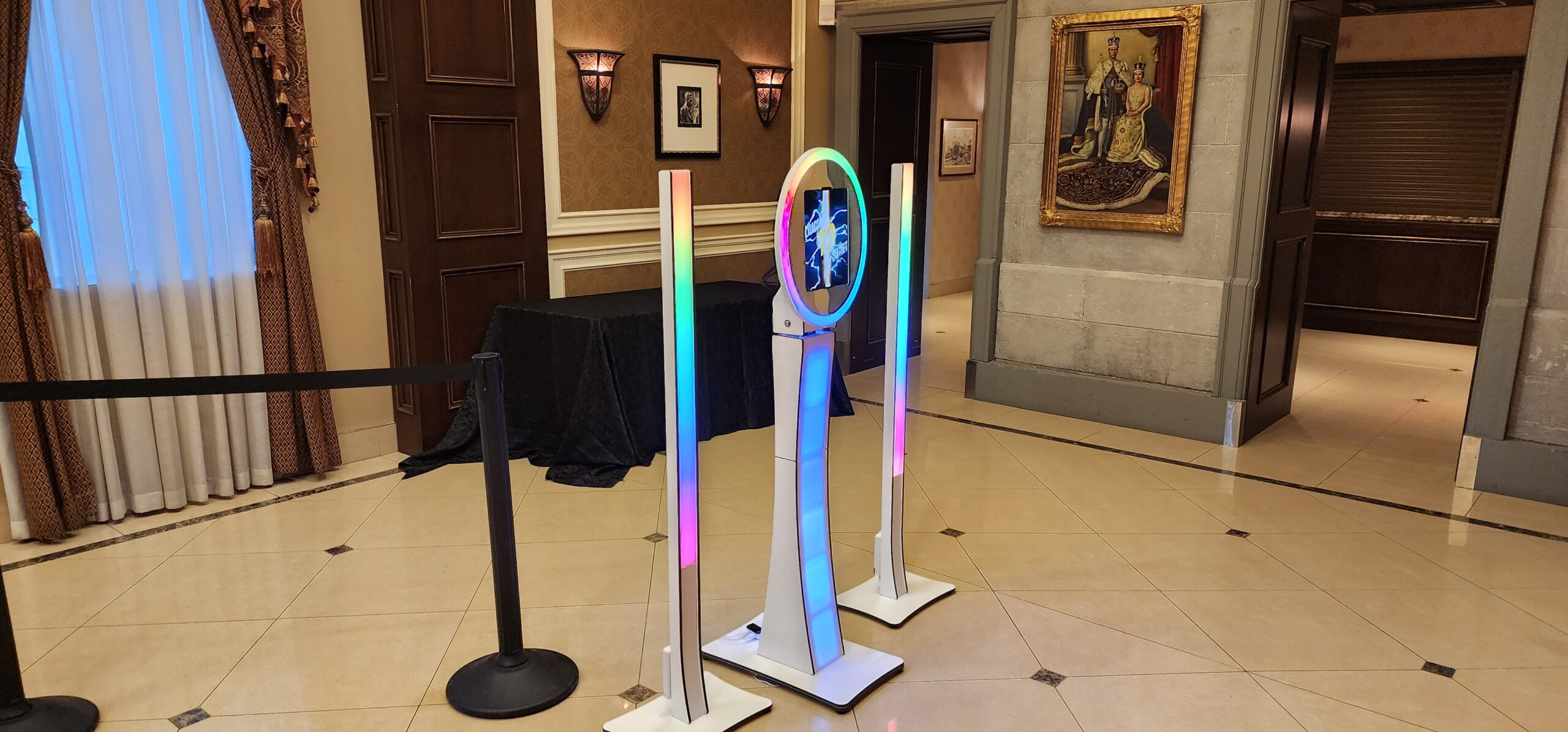 Social photo booth set up at an indoor event with illuminated light columns