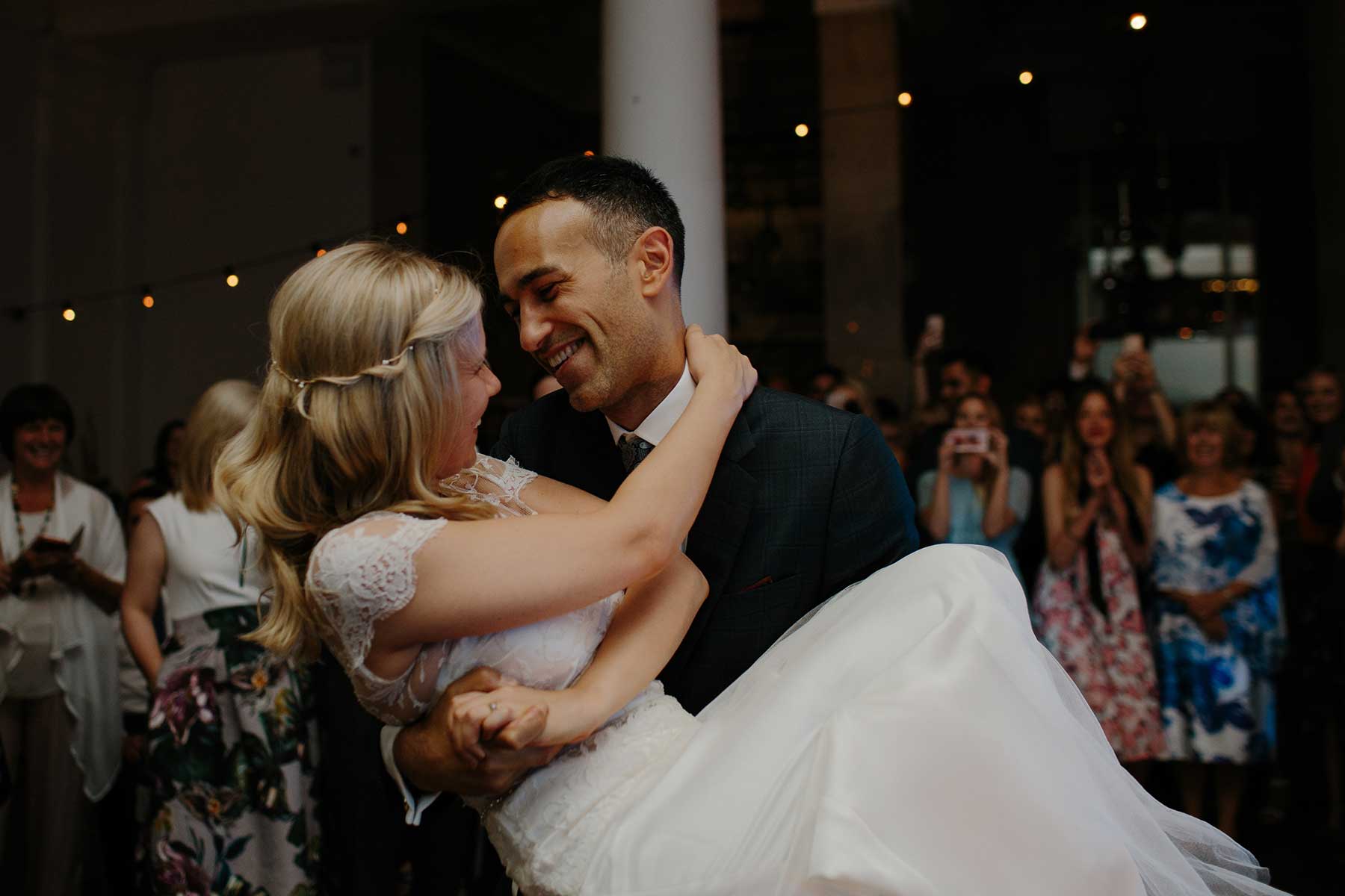 Bride and groom sharing a joyful wedding reception moment in Niagara