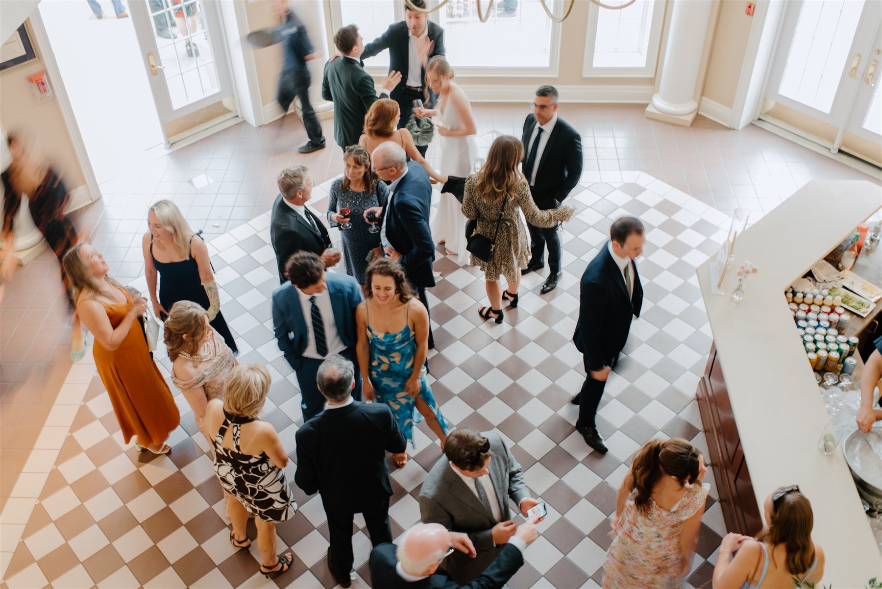 Wedding gathering in the bright Château des Charmes atrium