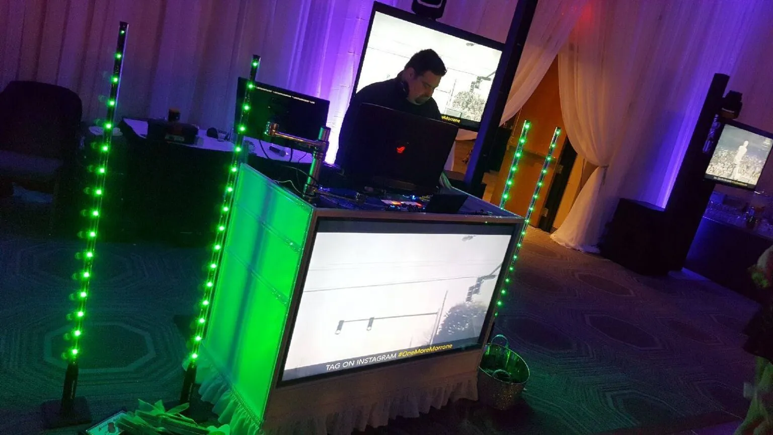 Music video party screen setup at a wedding