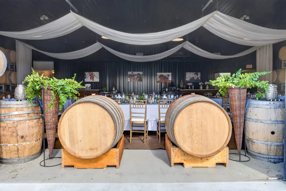 Indoor celebration space among the wine barrels