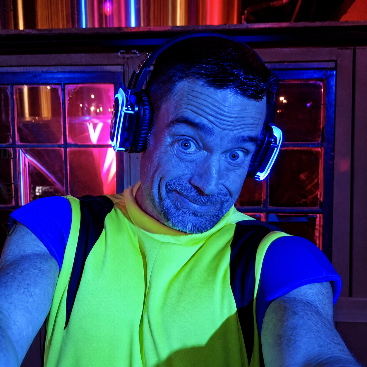 Luka Miller wearing glowing Silent Beats headphones at a live silent party