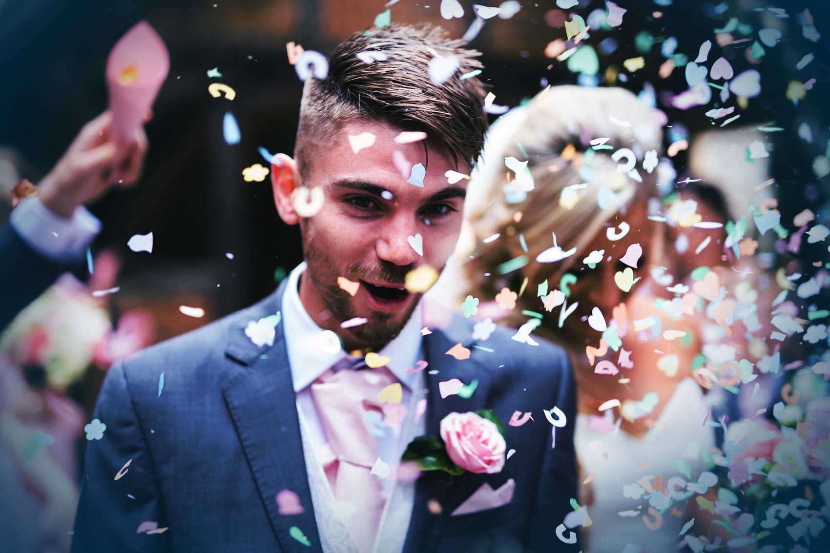 Newlyweds celebrating with confetti at a Niagara wedding reception