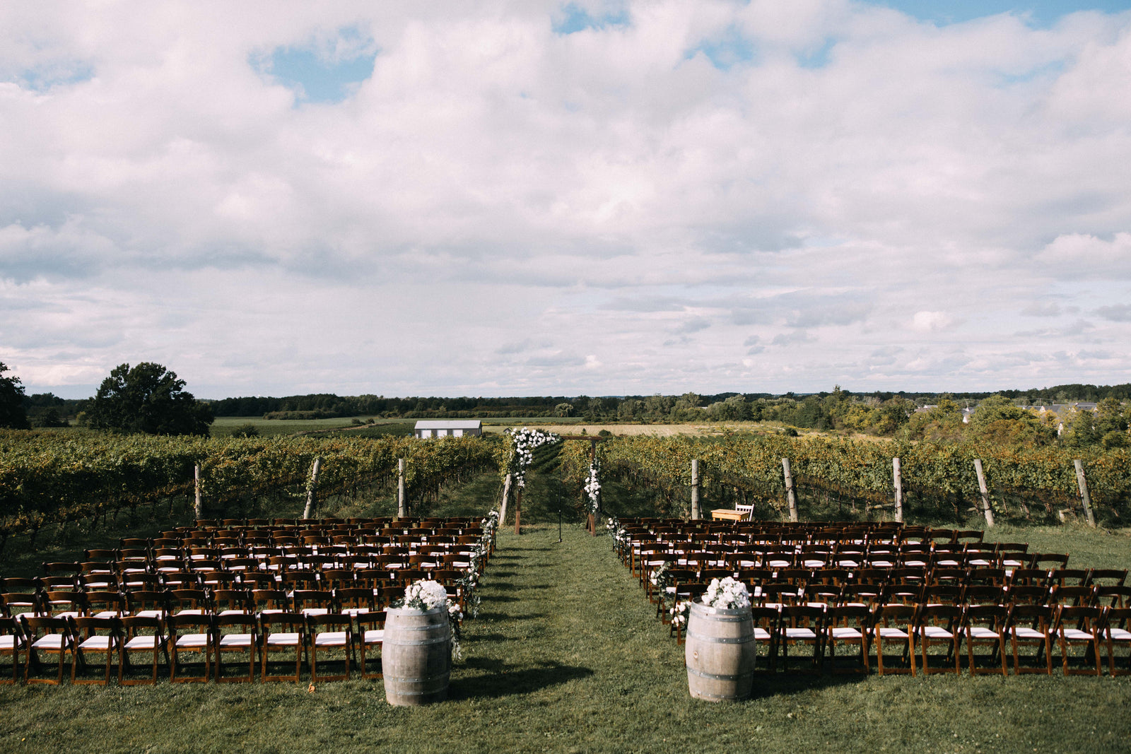Ceremony by the vines at Ravine Vineyard Estate Winery wedding venue