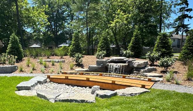Bridge and water feature in the Park 56 gardens