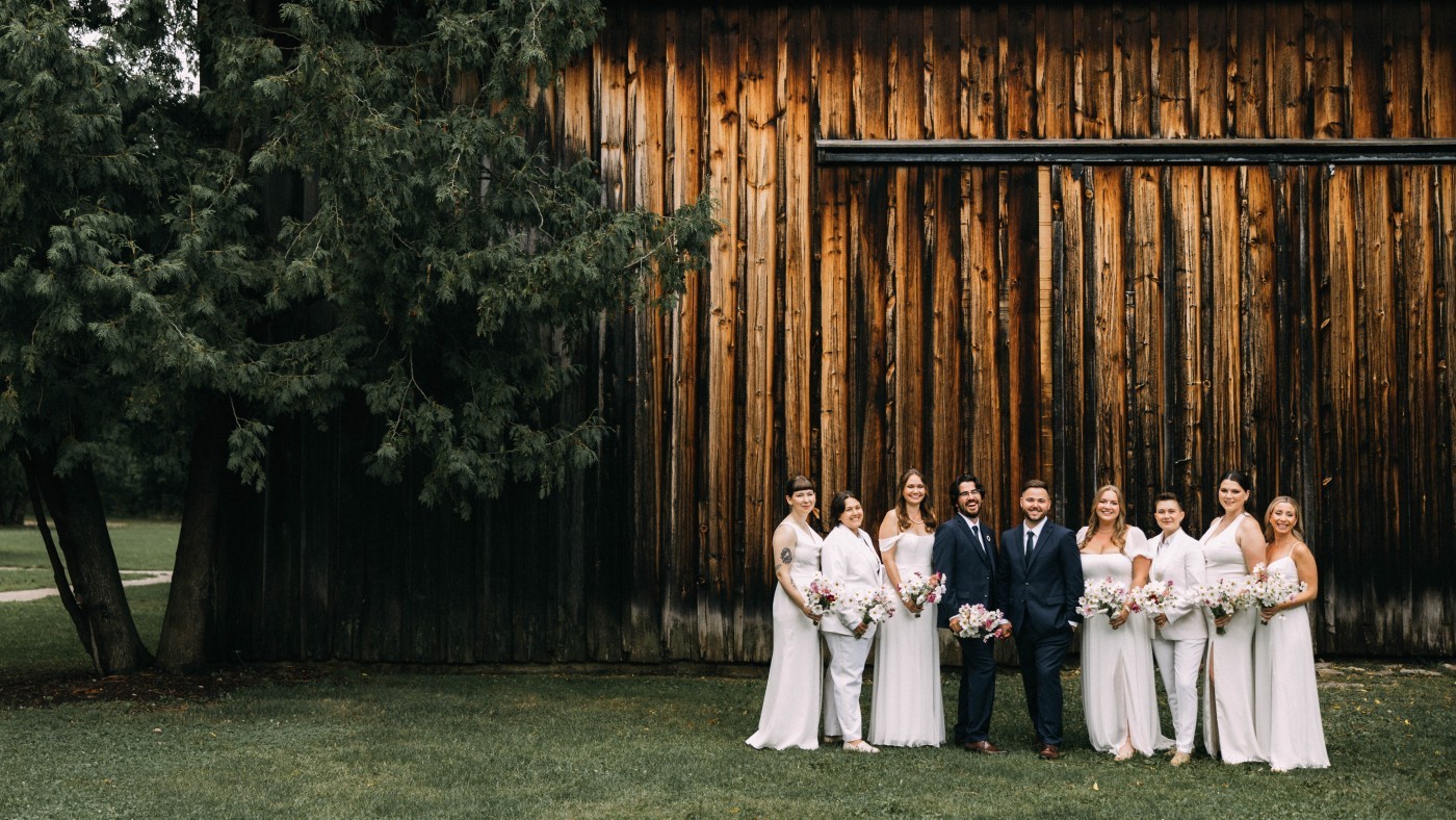 Wedding party beside the historic barn at Ball’s Falls