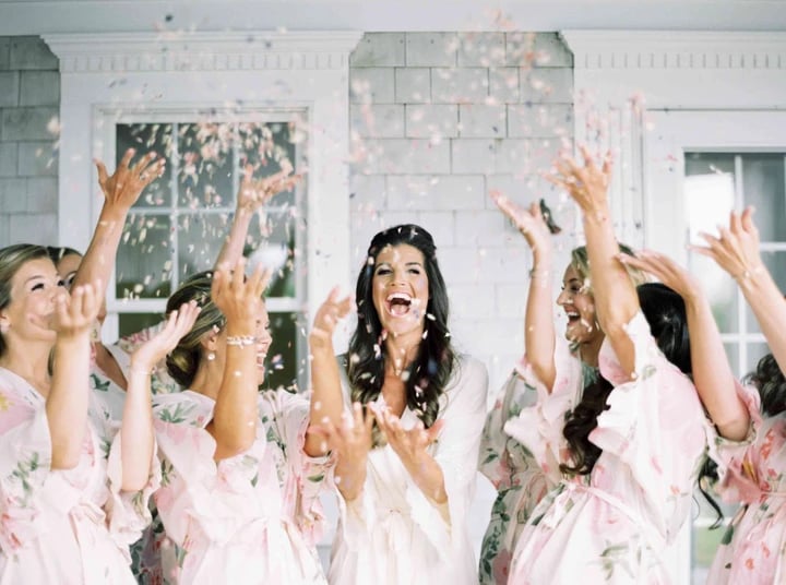 Bride celebrating with her bridesmaids