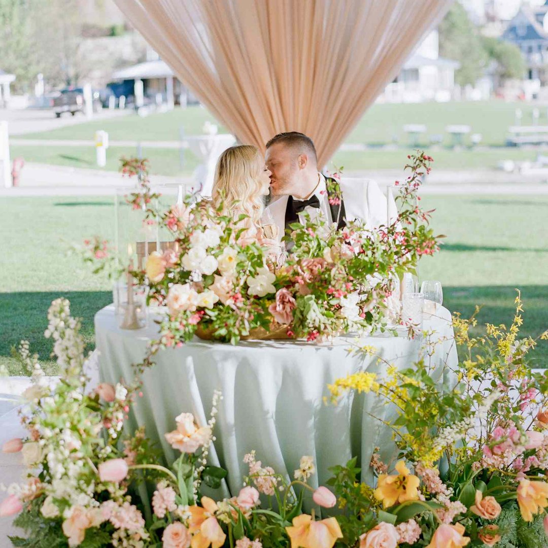 Floral sweetheart table designed for a wedding reception