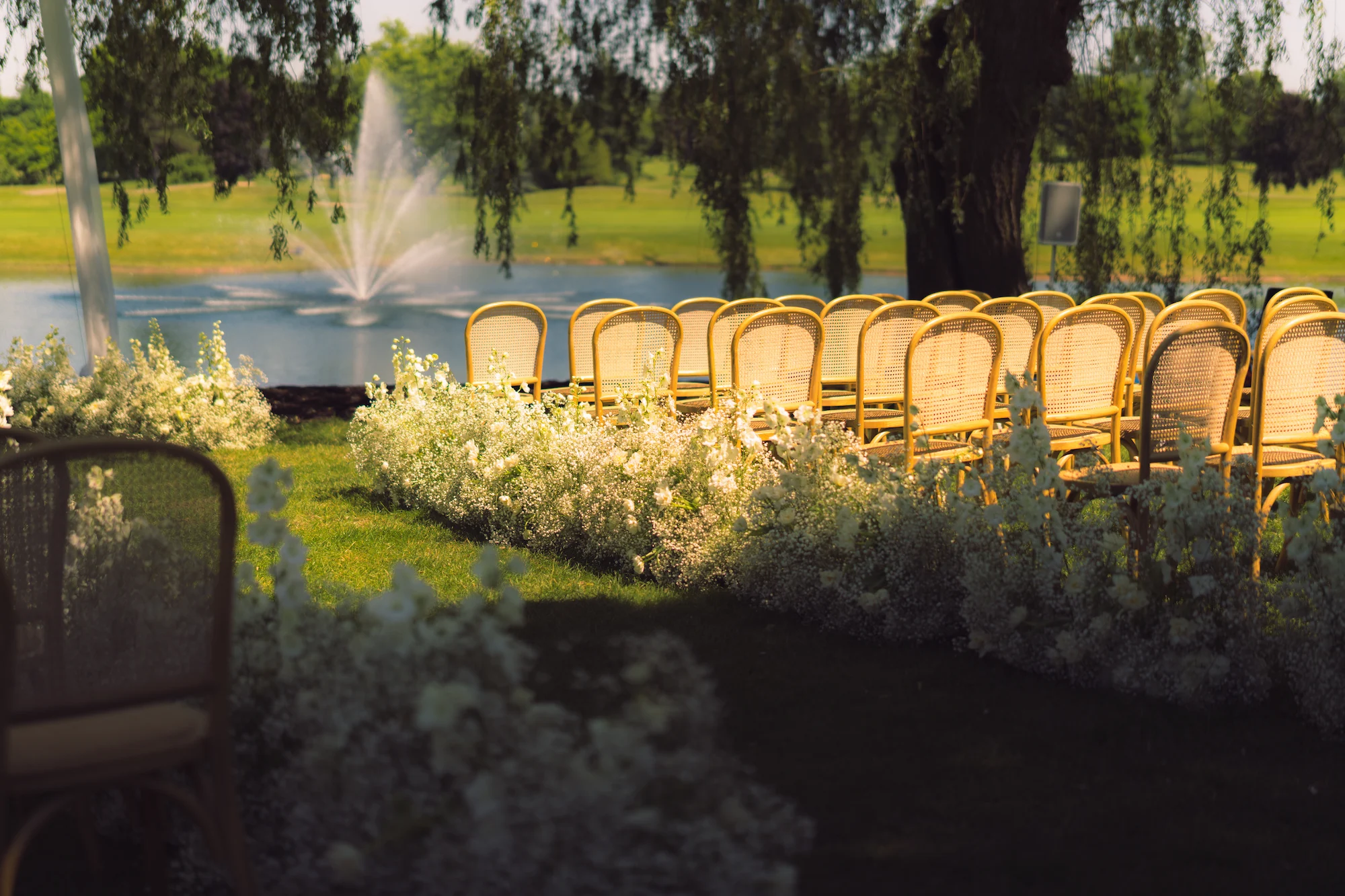 Outdoor ceremony beside the water at The Hawk
