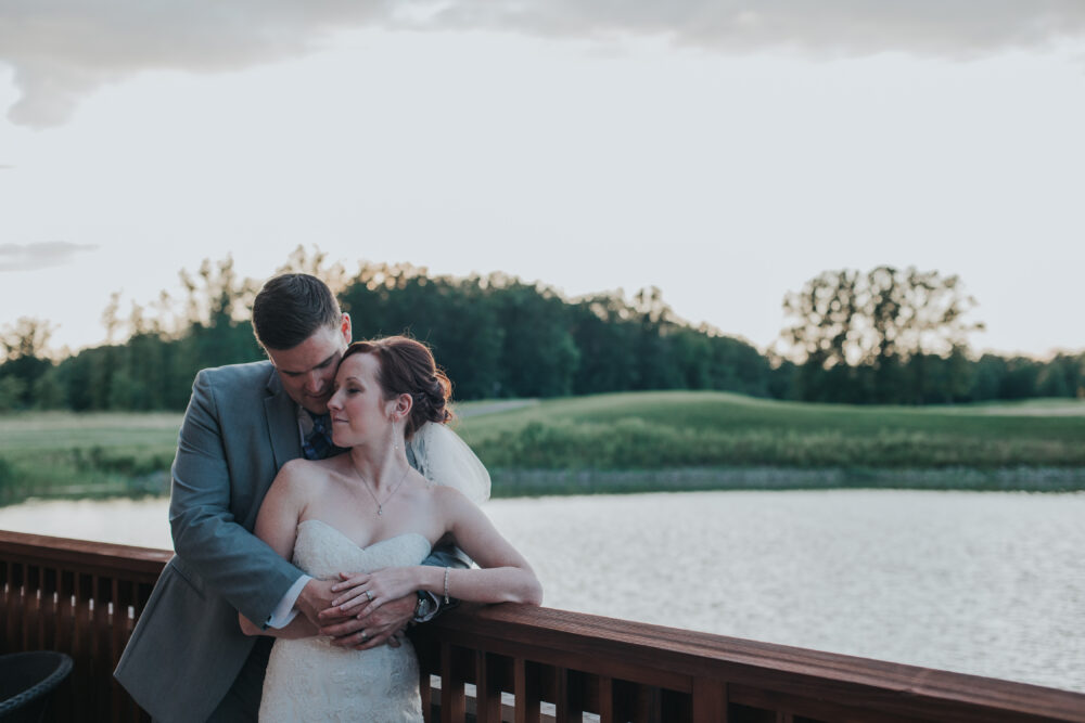 Newlyweds on the lakeside terrace at Legends on the Niagara