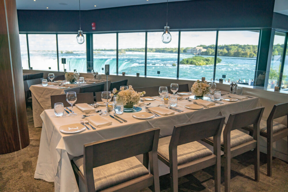 Dining tables with a panoramic Falls view at Table Rock House