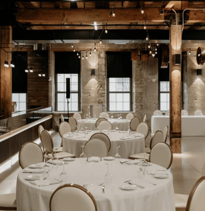 Industrial wedding reception setup at Tapestry Hall